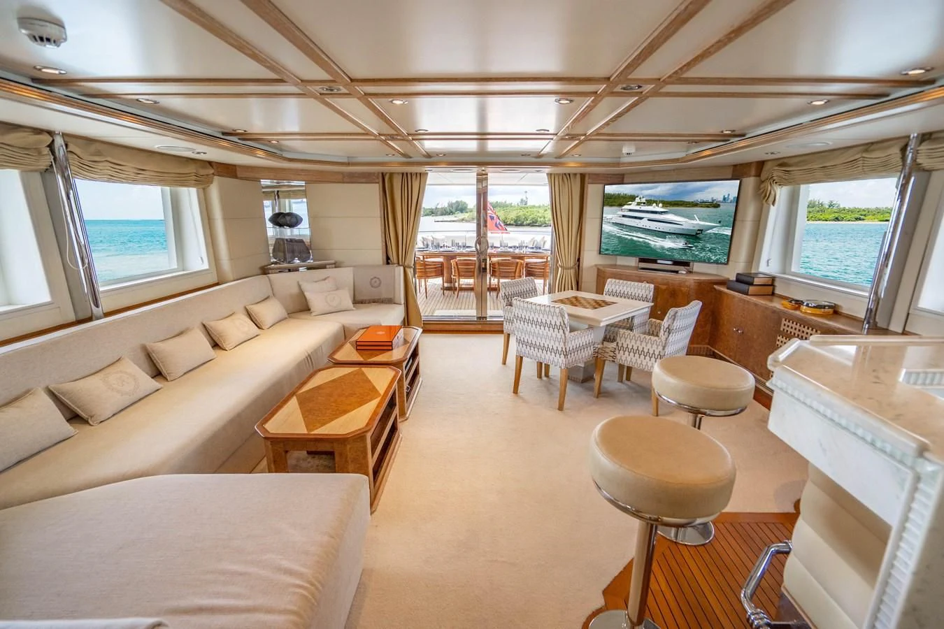 a room with a couch and a table and chairs aboard ARTEMISEA Yacht for Sale