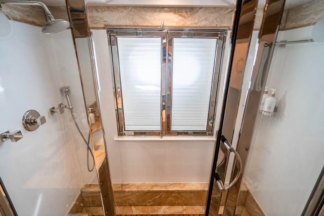 a bathroom with a shower and a sink aboard ARTEMISEA Yacht for Sale