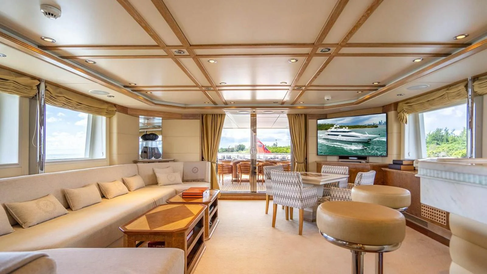 a living room with a large screen aboard ARTEMISEA Yacht for Sale