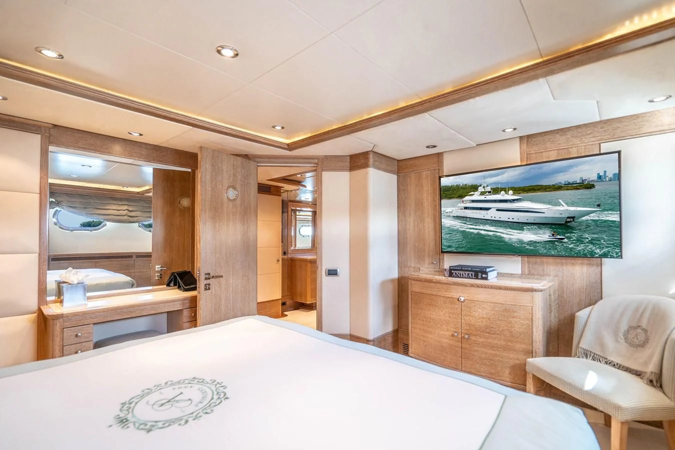 a room with a bed and a table aboard ARTEMISEA Yacht for Sale