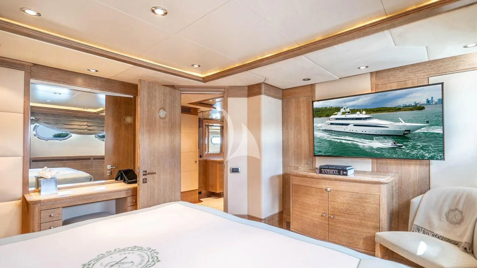 a room with a bed and a desk aboard ARTEMISEA Yacht for Sale