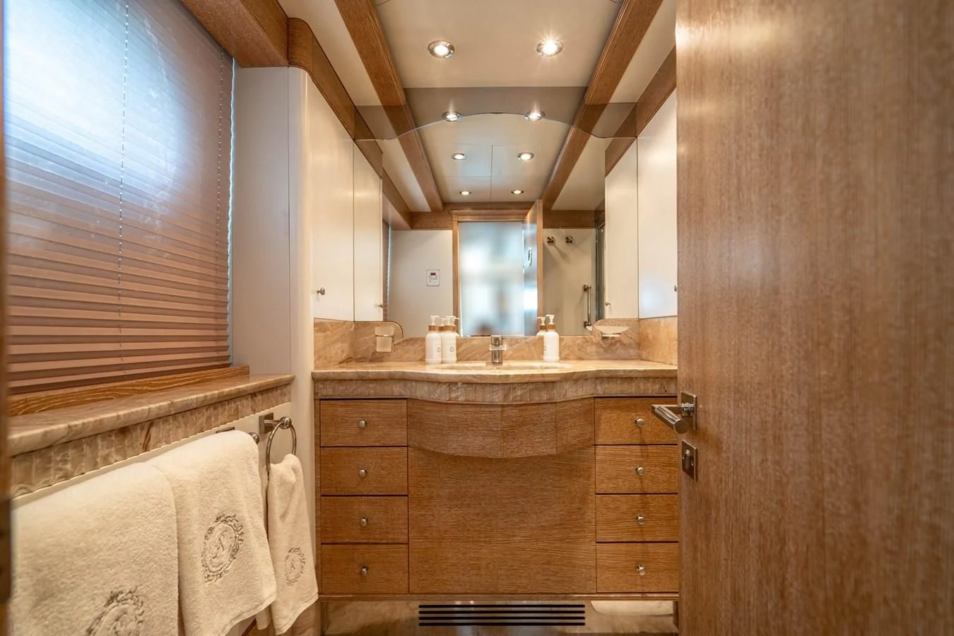 a bathroom with a sink and a mirror aboard ARTEMISEA Yacht for Sale