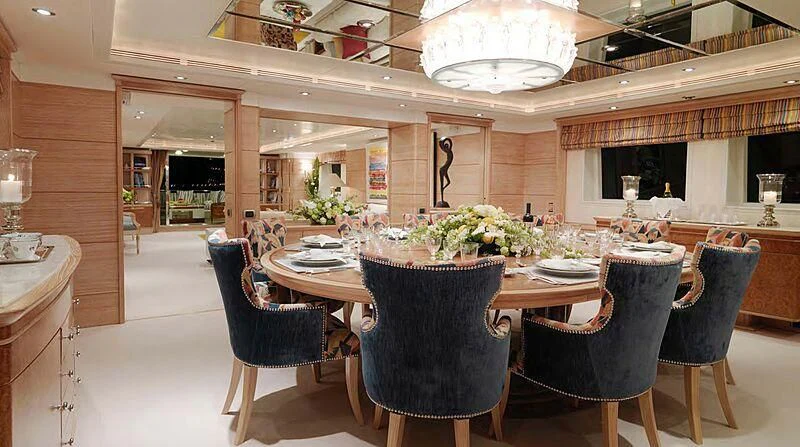 a dining room with a table and chairs aboard ARTEMISEA Yacht for Sale