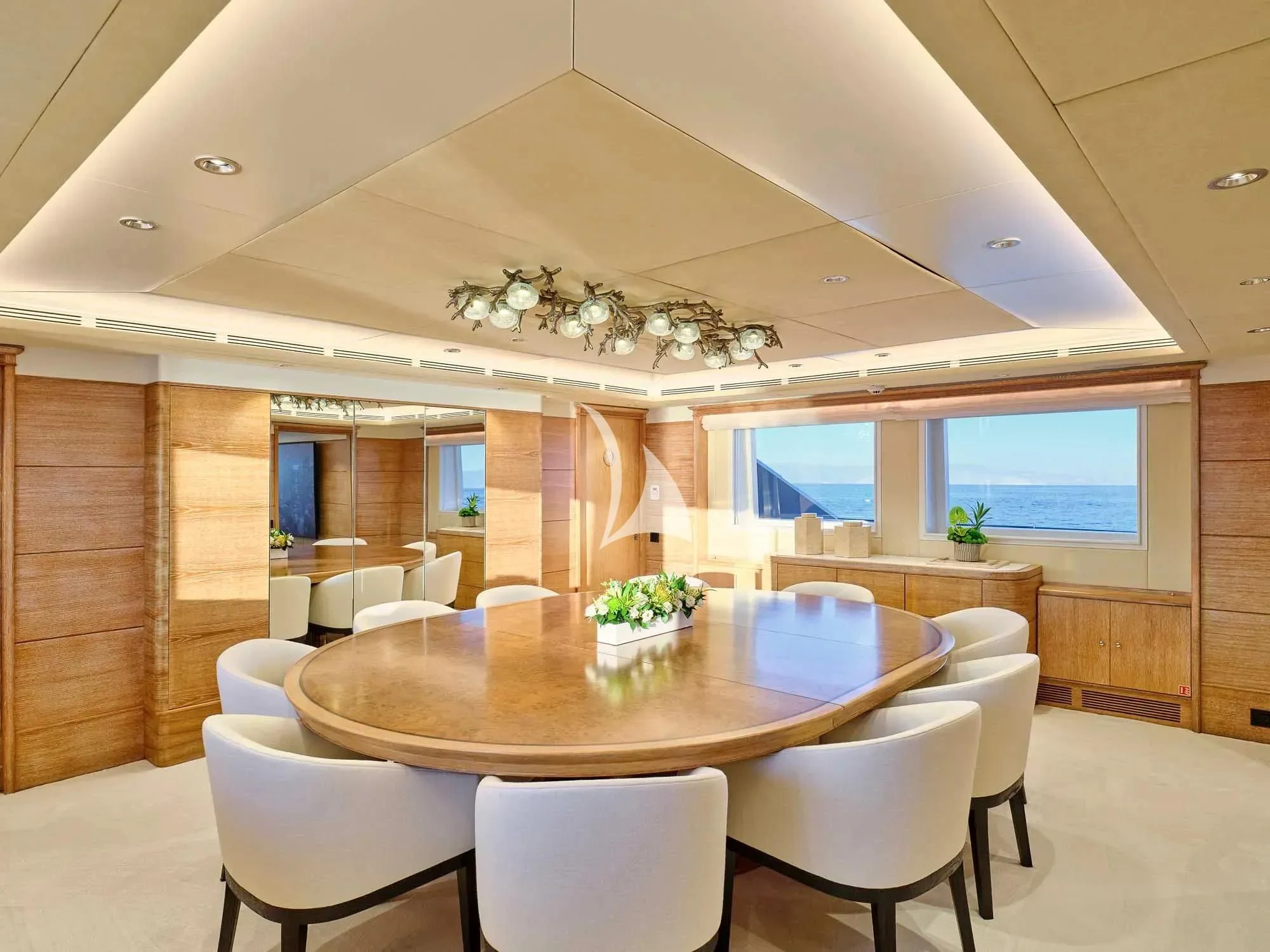 a room with a table and chairs aboard ARTEMISEA Yacht for Sale