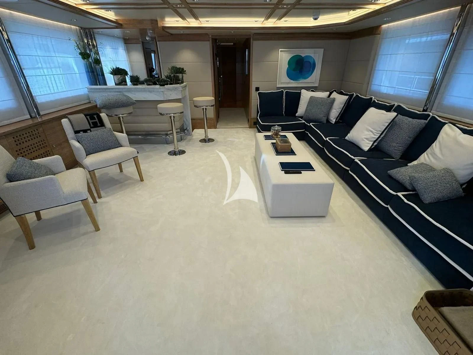 a room with a couch and a table aboard ARTEMISEA Yacht for Sale