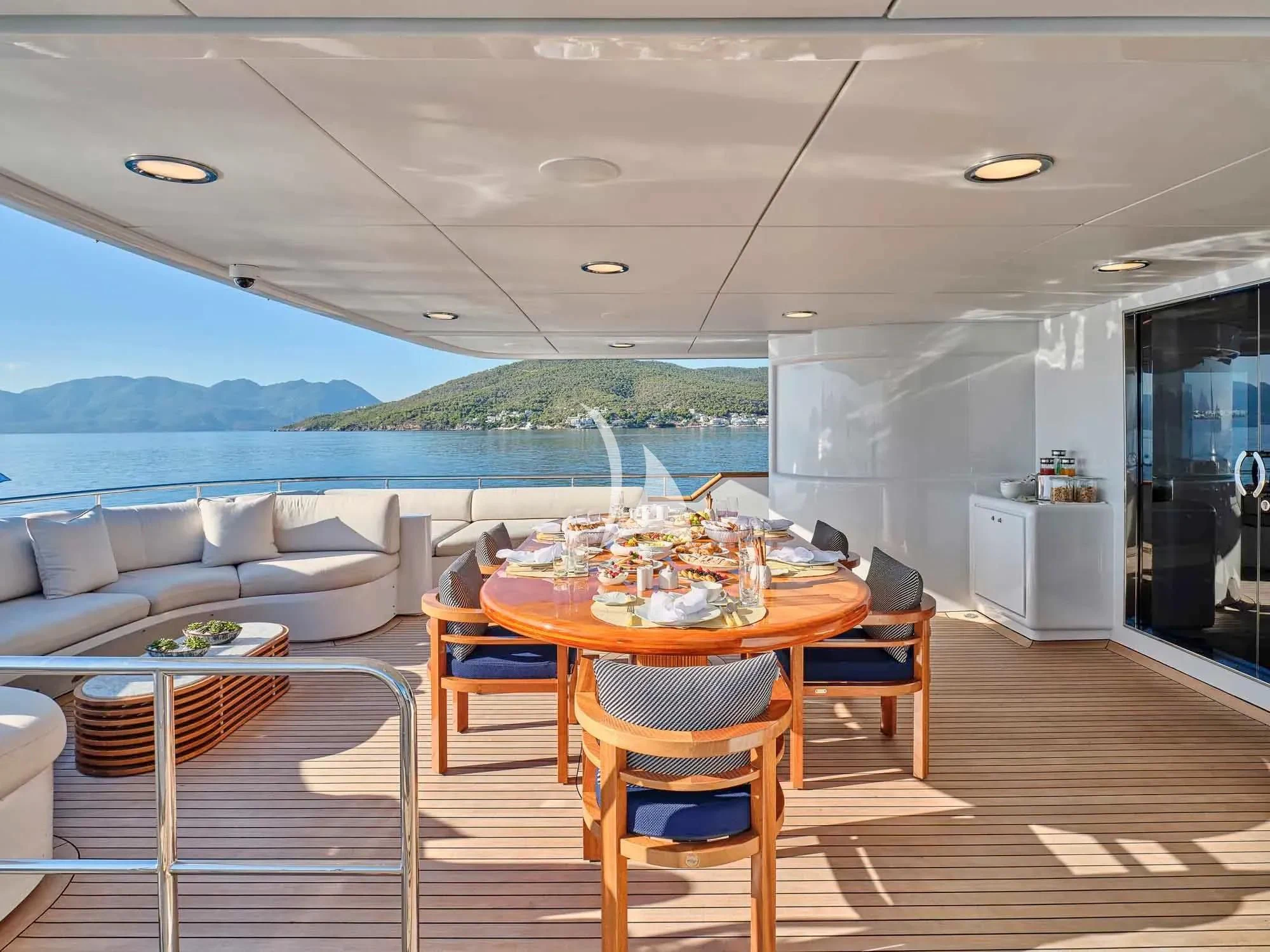 a large kitchen with a table and chairs aboard ARTEMISEA Yacht for Sale