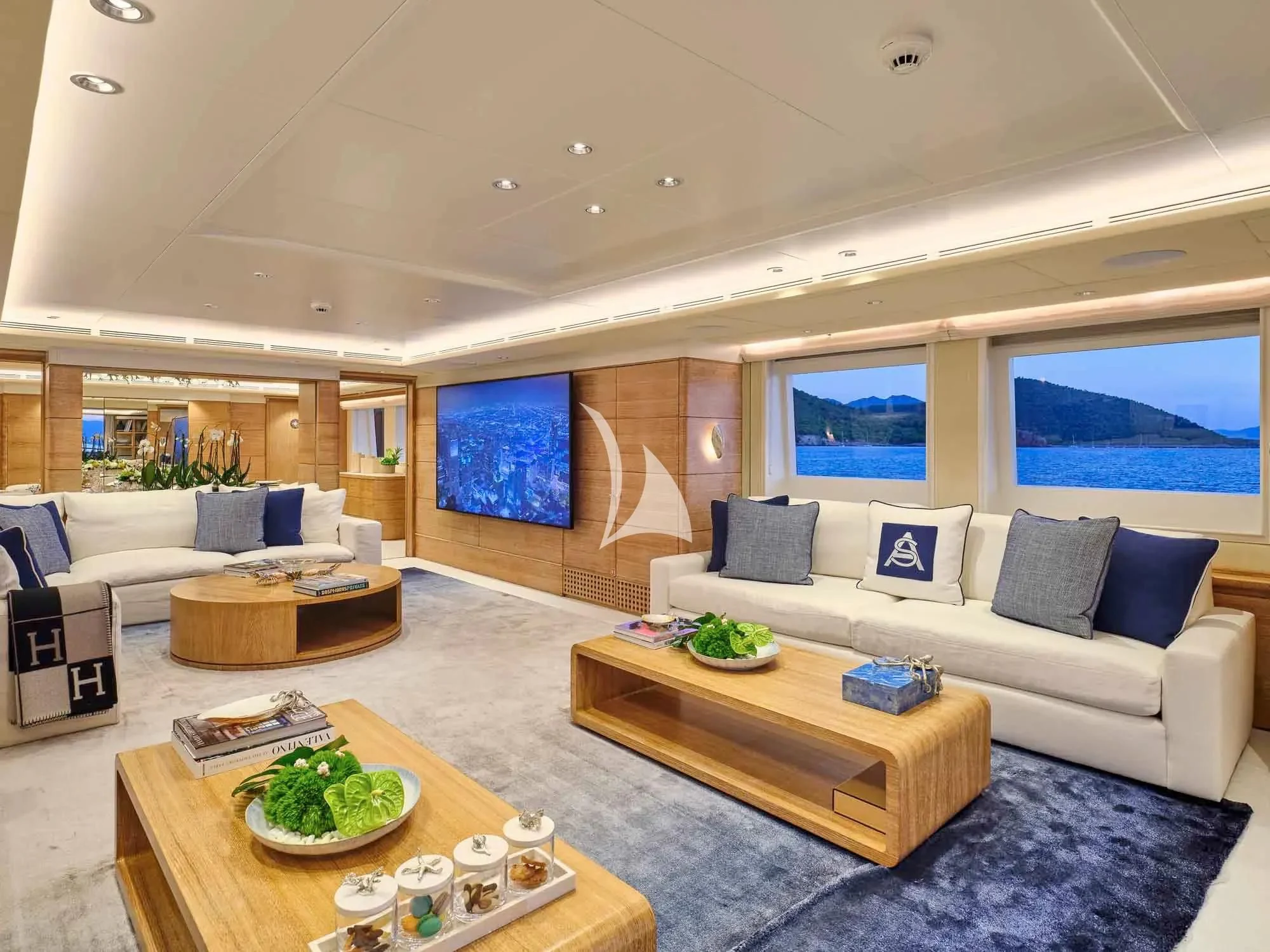 a living room with a couch and a table aboard ARTEMISEA Yacht for Sale