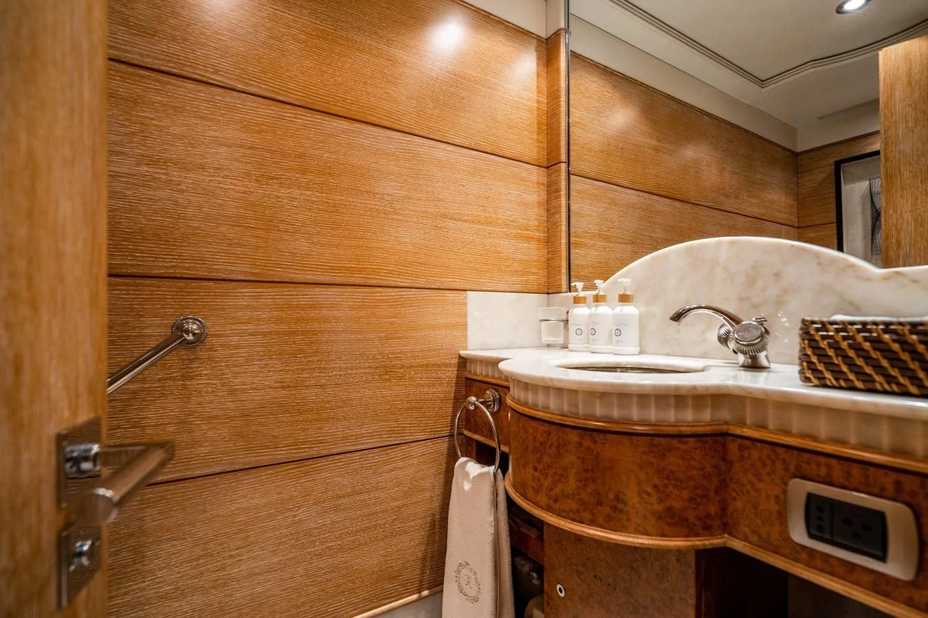 a bathroom with wooden cabinets aboard ARTEMISEA Yacht for Sale