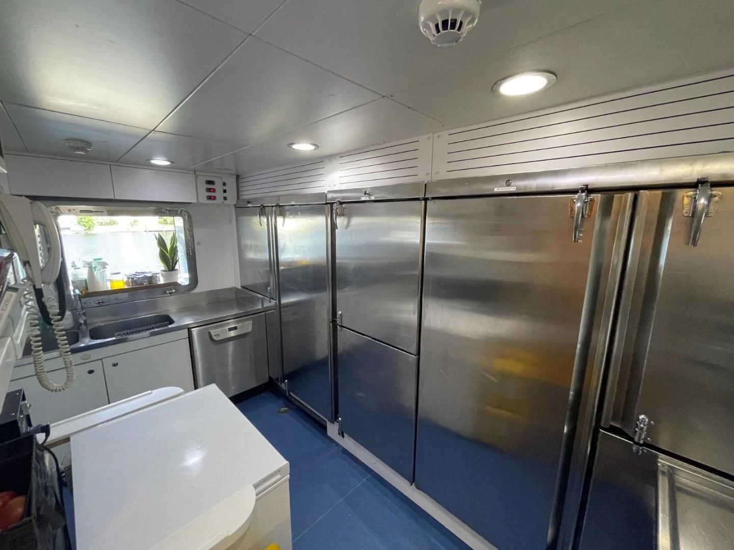 a kitchen with glass doors aboard ARTEMISEA Yacht for Sale