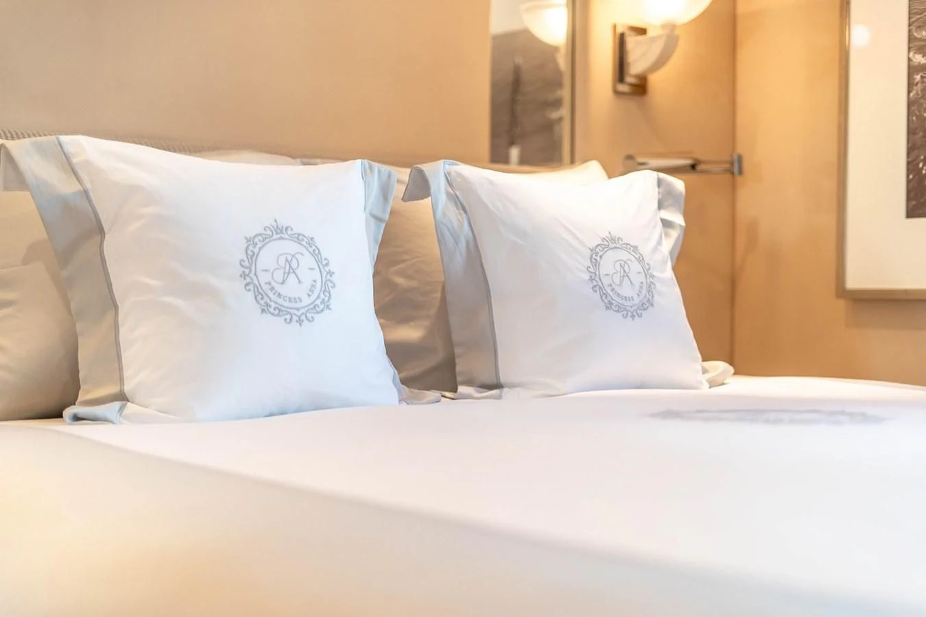 a bed with white sheets aboard ARTEMISEA Yacht for Sale