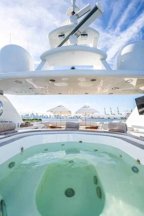 a large white boat with a blue water slide aboard ARTEMISEA Yacht for Sale