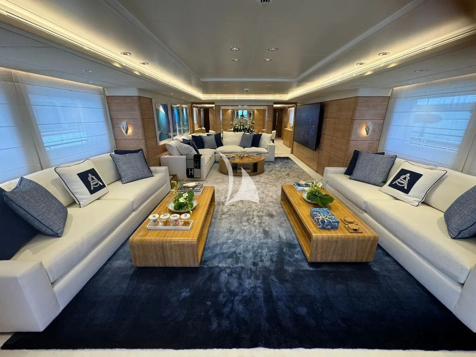 a living room with a couch and a coffee table aboard ARTEMISEA Yacht for Sale