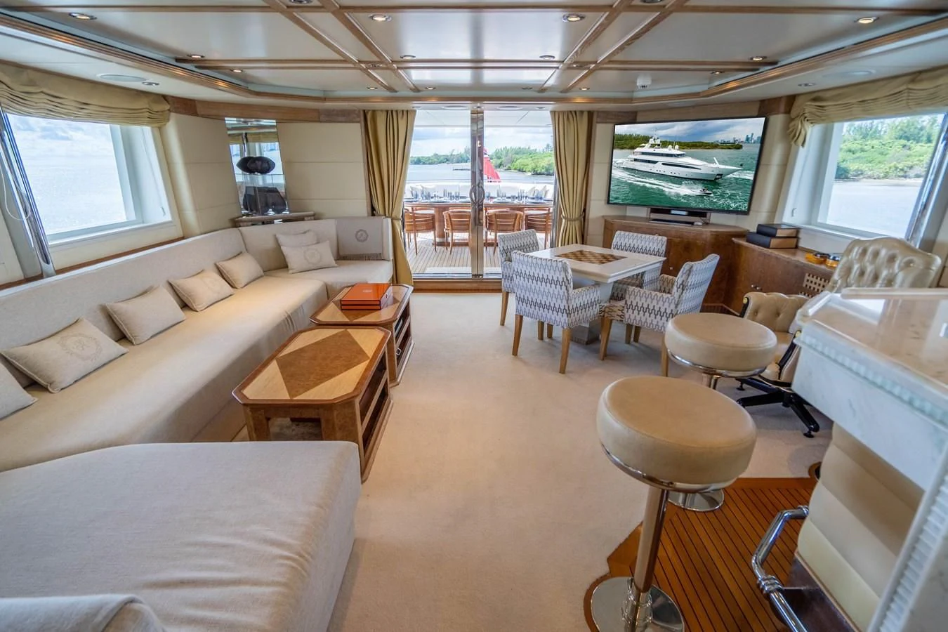 a living room with a couch and chairs aboard ARTEMISEA Yacht for Sale