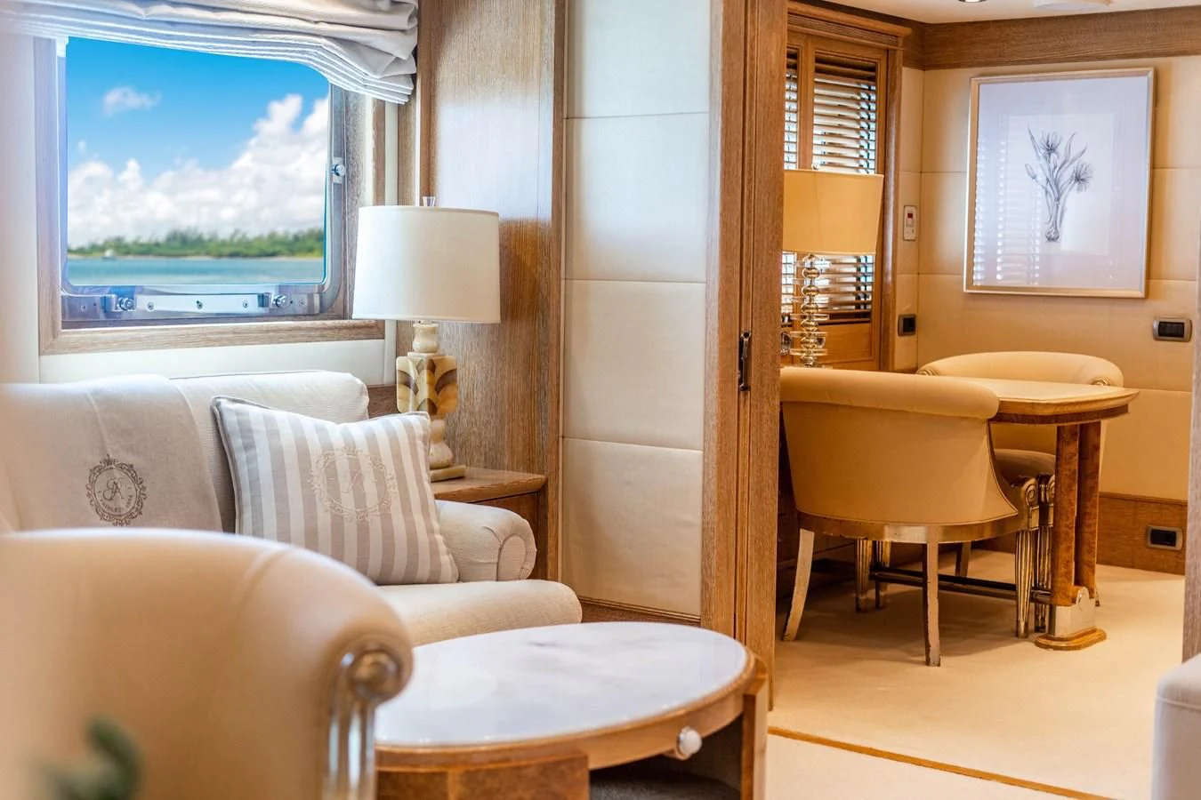 a room with a table chairs and a window aboard ARTEMISEA Yacht for Sale