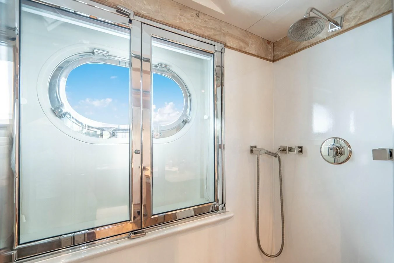 a bathroom with a glass shower aboard ARTEMISEA Yacht for Sale