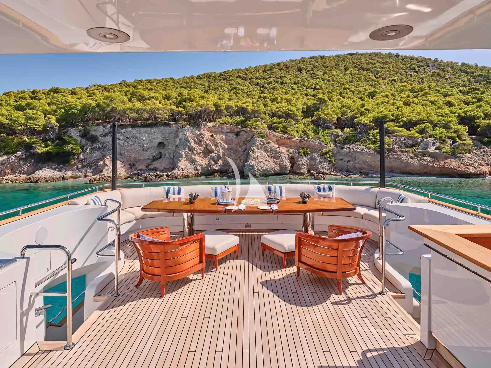 a deck with a pool and a view of the mountains aboard ARTEMISEA Yacht for Sale