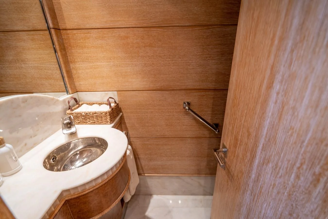 a bathroom with a toilet and sink aboard ARTEMISEA Yacht for Sale