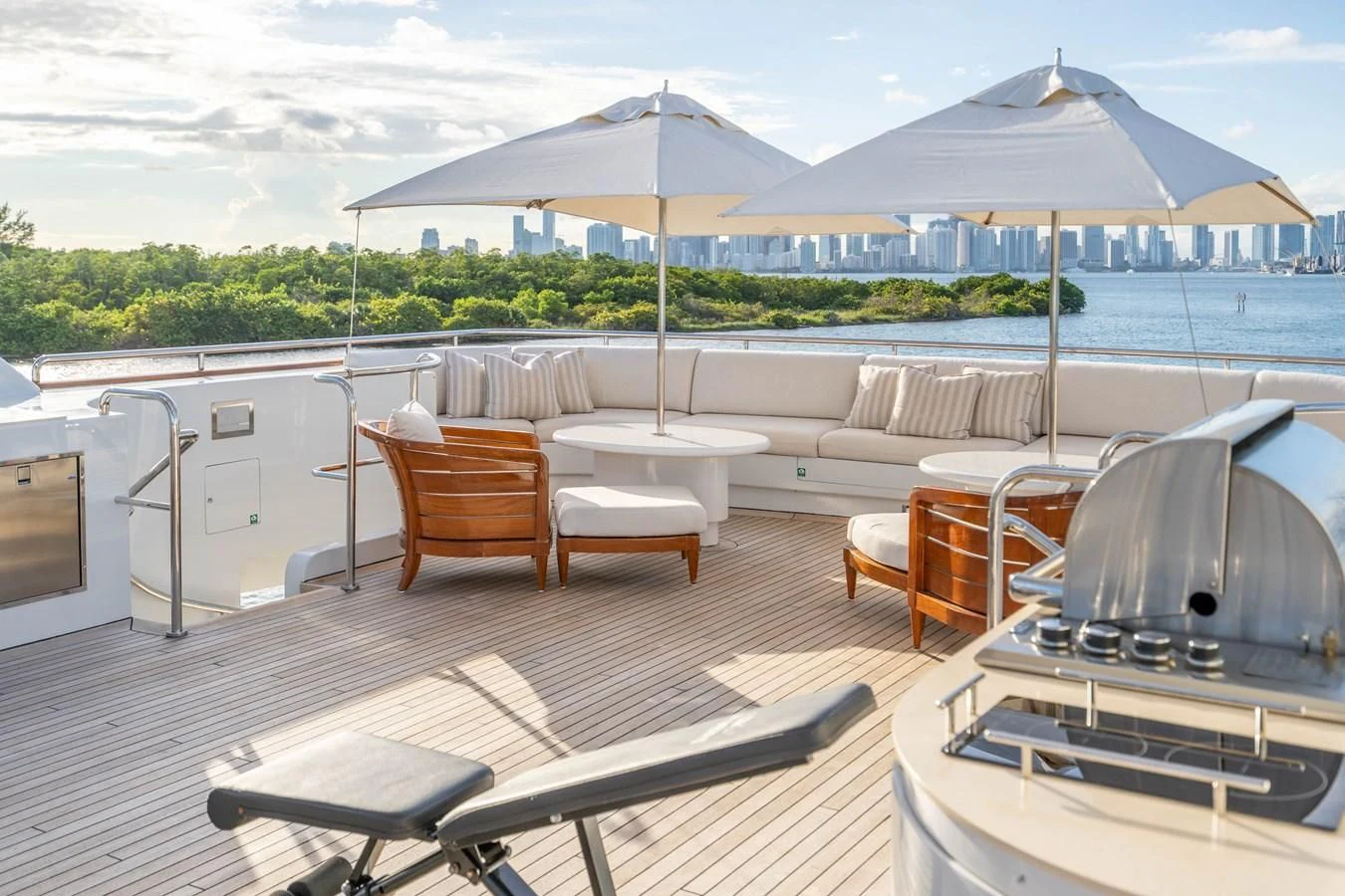 a deck with a table and chairs on it aboard ARTEMISEA Yacht for Sale