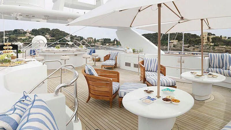 a large white tent with a table and chairs and a table with food on it aboard ARTEMISEA Yacht for Sale