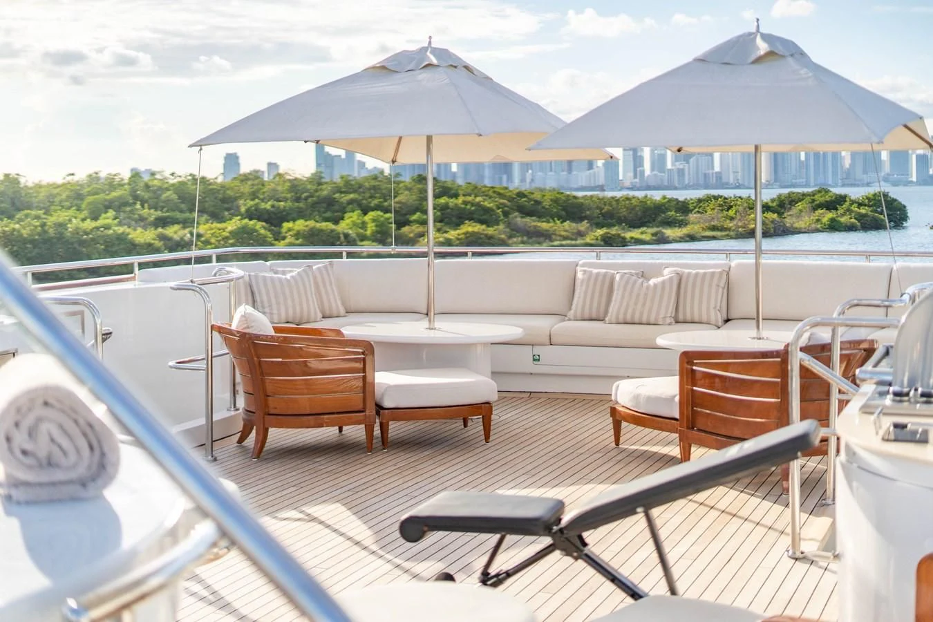 a deck with tables and chairs aboard ARTEMISEA Yacht for Sale