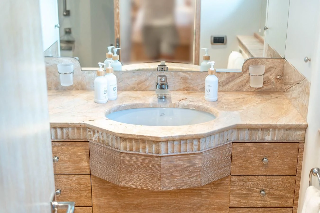 a bathroom sink with a mirror aboard ARTEMISEA Yacht for Sale