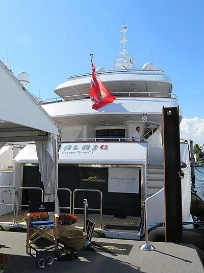 a large white boat with a flag on the front aboard ARTEMISEA Yacht for Sale