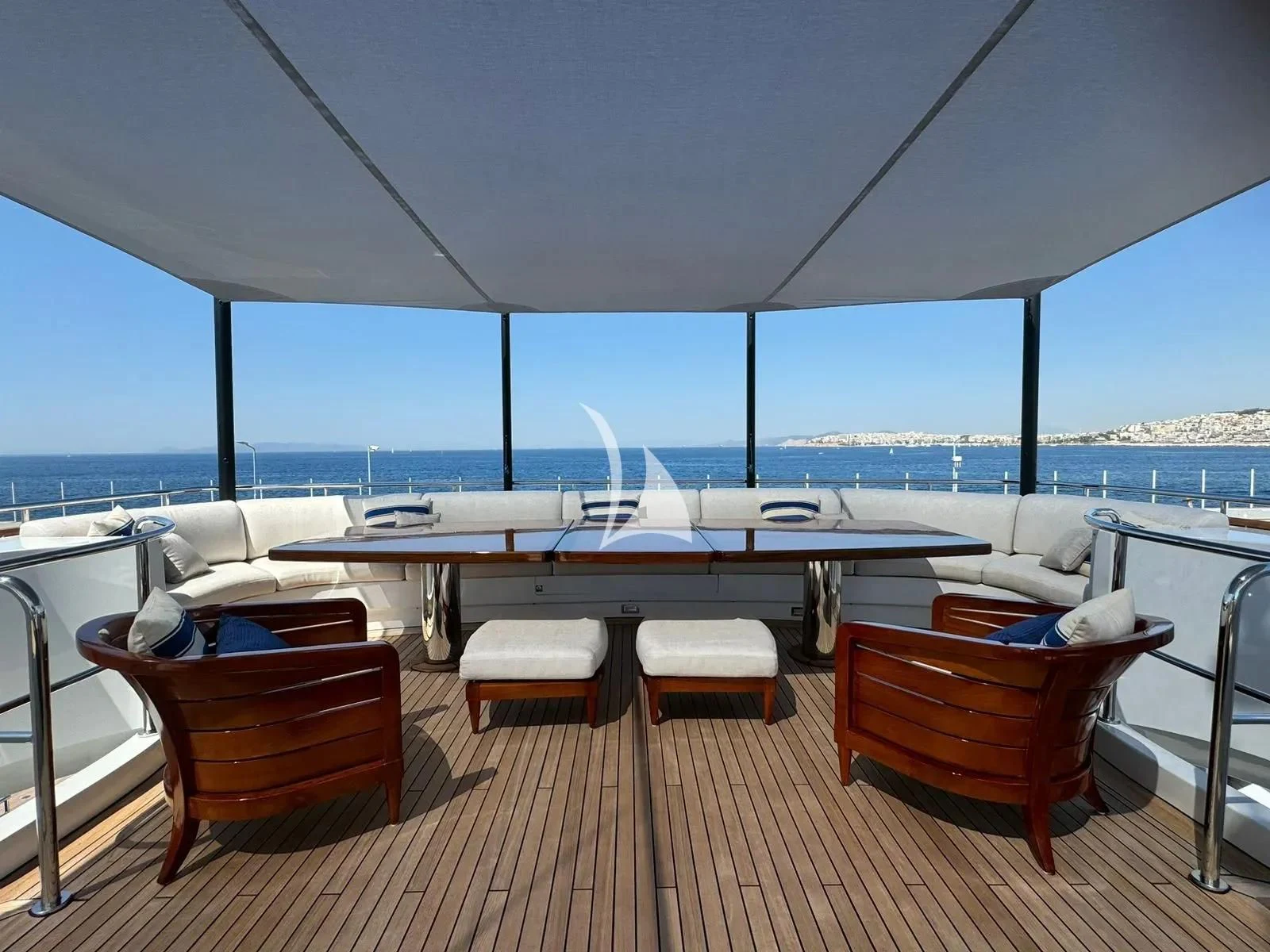 a deck with a view of the water and a city aboard ARTEMISEA Yacht for Sale