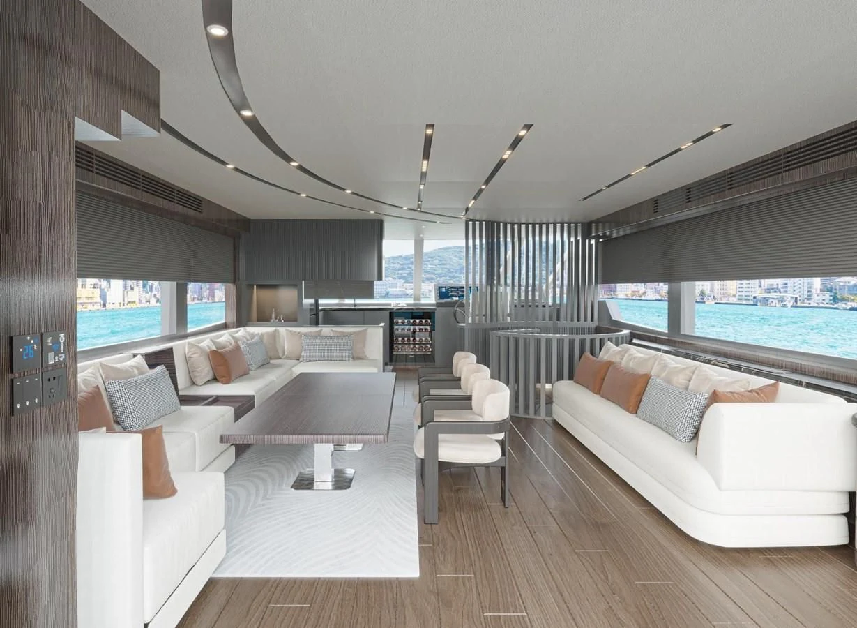 a living room with a large window aboard AQUITALIA 68 Yacht for Sale