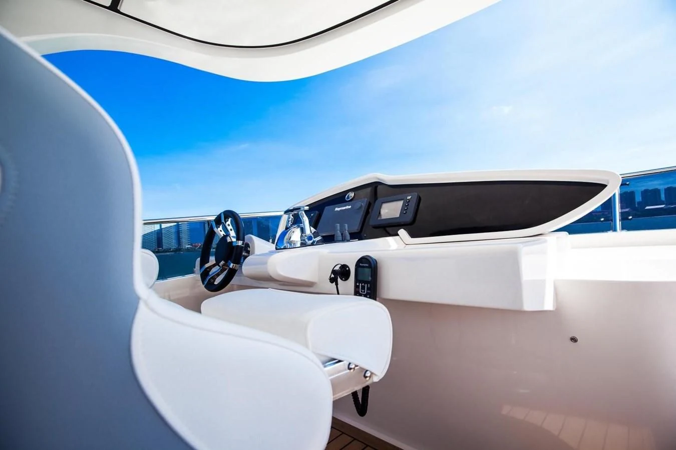 a white airplane with a black seat aboard AQUITALIA 68 Yacht for Sale