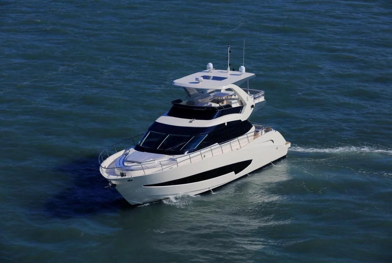 a white boat in the water aboard AQUITALIA 68 Yacht for Sale