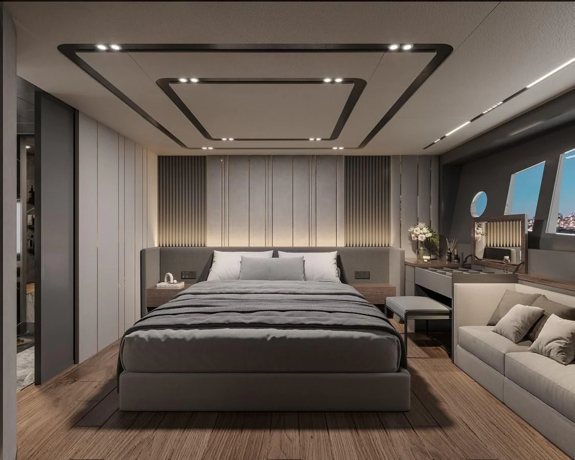 a bedroom with a bed and a desk aboard AQUITALIA 68 Yacht for Sale