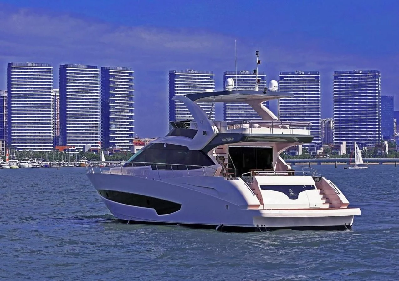 a white yacht in the water aboard AQUITALIA 68 Yacht for Sale