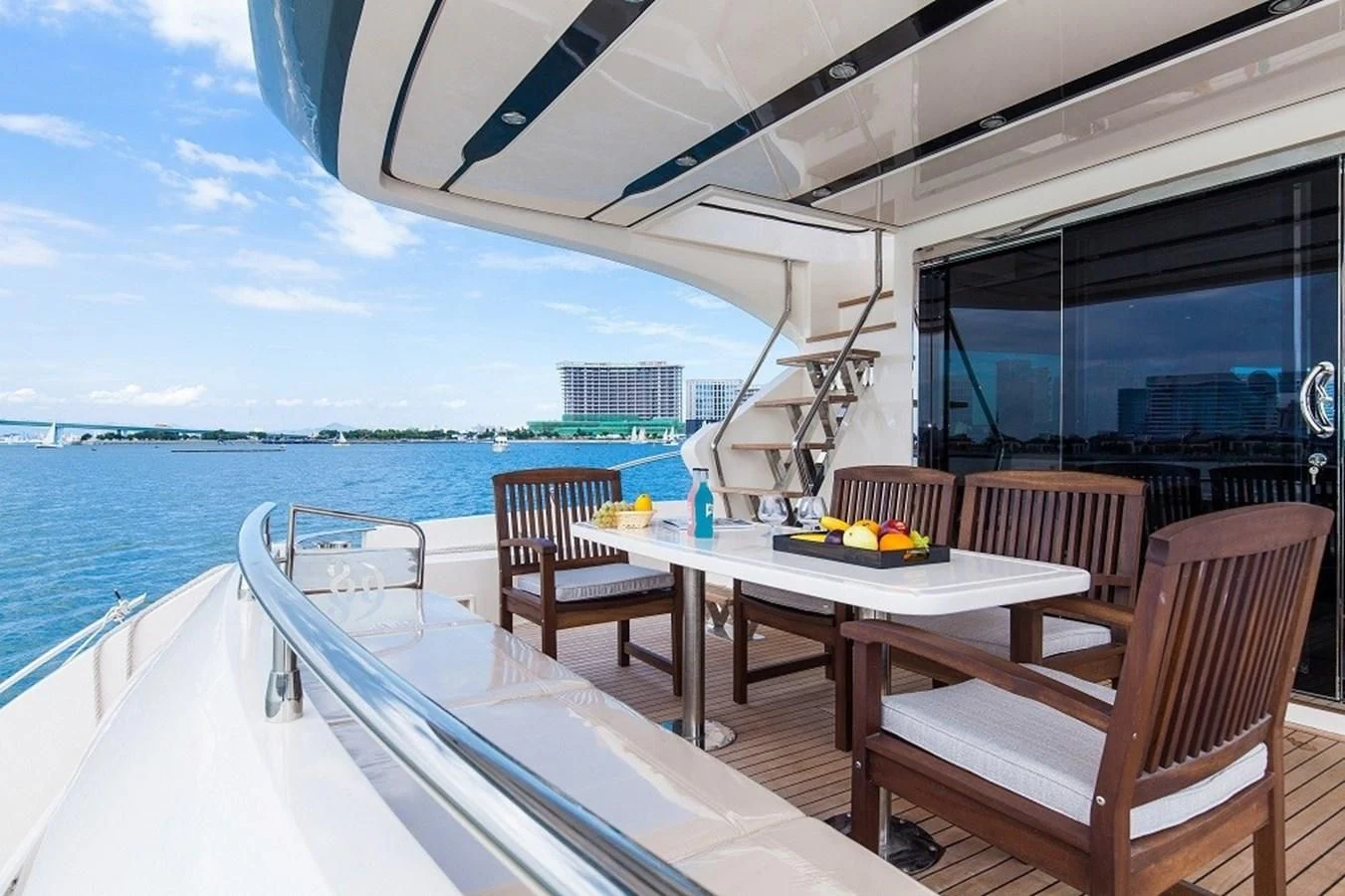 a table and chairs on a boat aboard AQUITALIA 68 Yacht for Sale