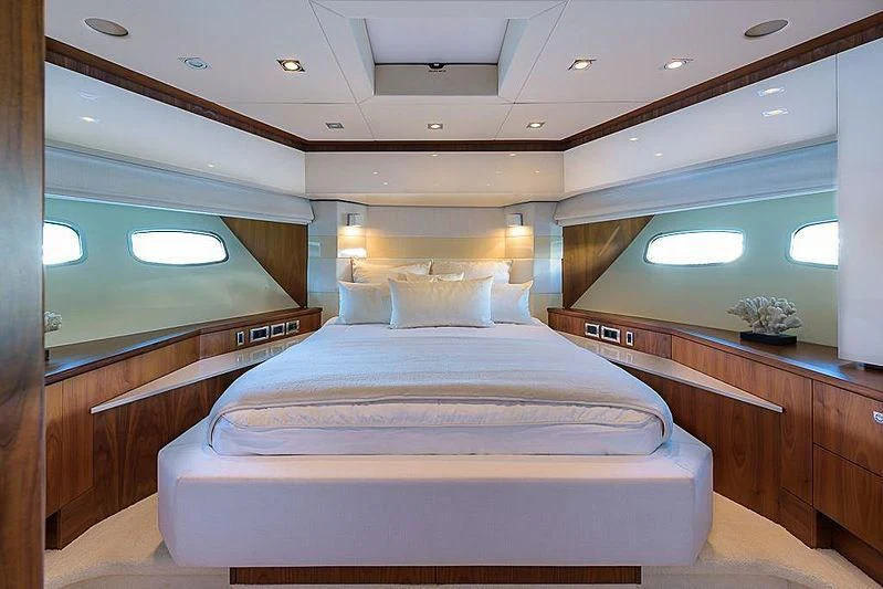 a room with a bed and a window aboard COPPER 3 Yacht for Sale