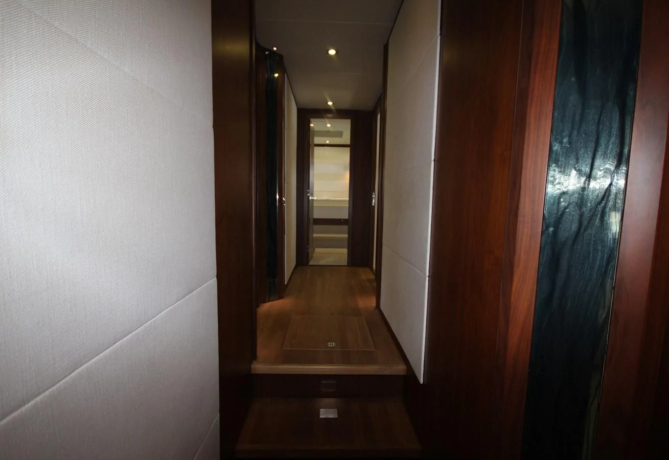 a hallway with a door and a window aboard COPPER 3 Yacht for Sale