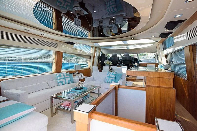 a room with a couch and a table aboard COPPER 3 Yacht for Sale