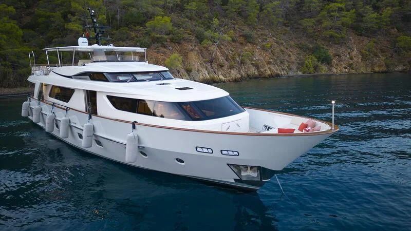 a white boat on water aboard AQUILA Q Yacht for Sale