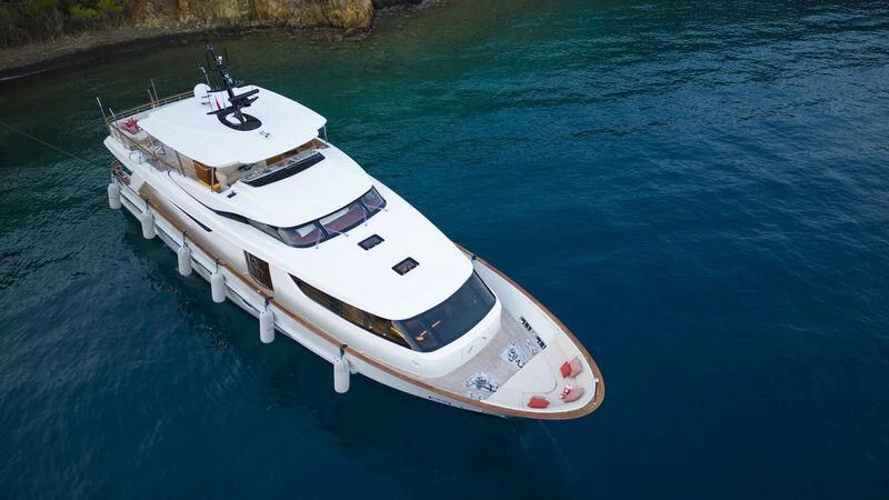 a white boat on water aboard AQUILA Q Yacht for Sale