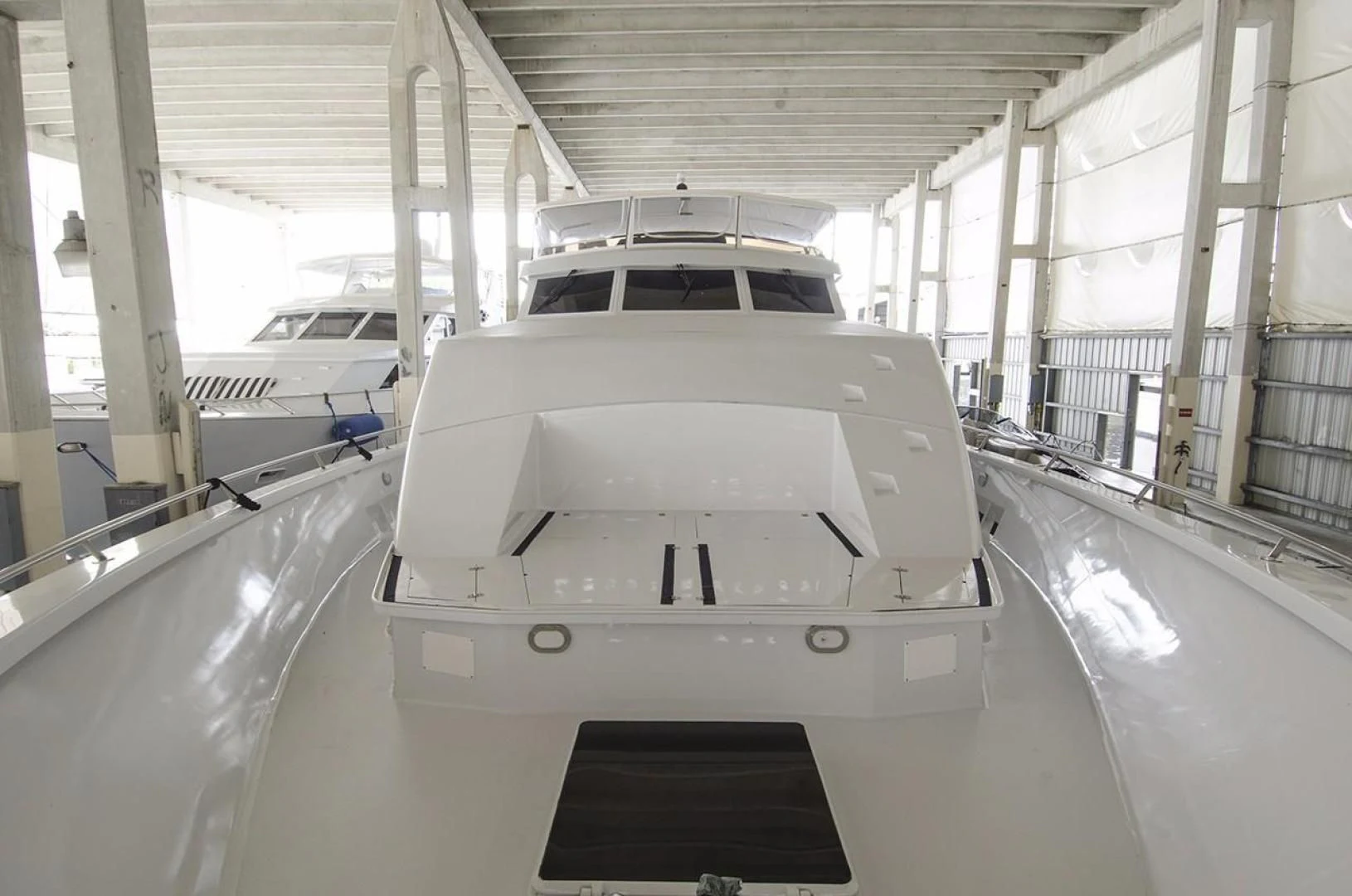 a white car in a building aboard GOLDEN TOUCH Yacht for Sale