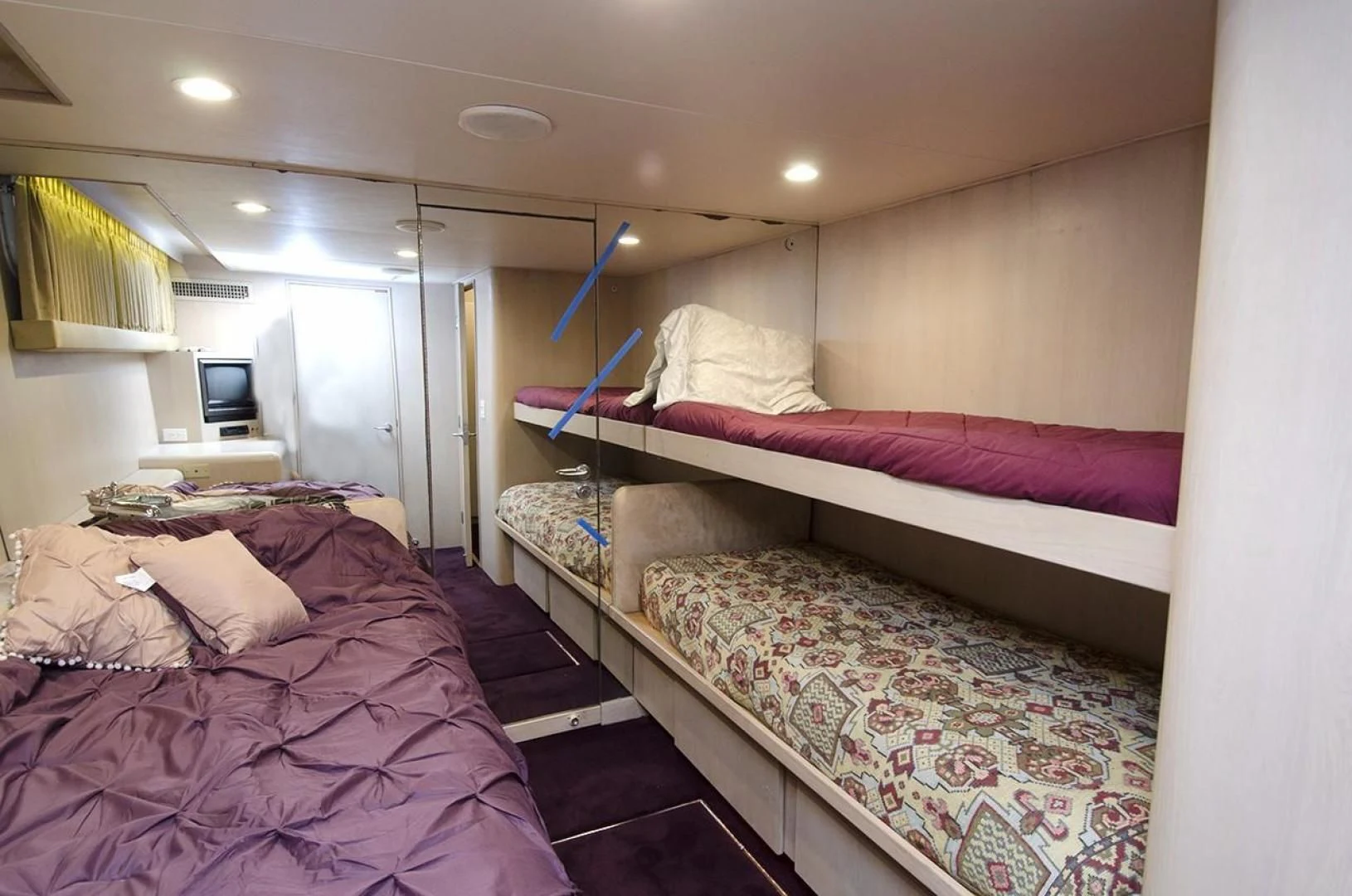 a bedroom with two beds aboard GOLDEN TOUCH Yacht for Sale