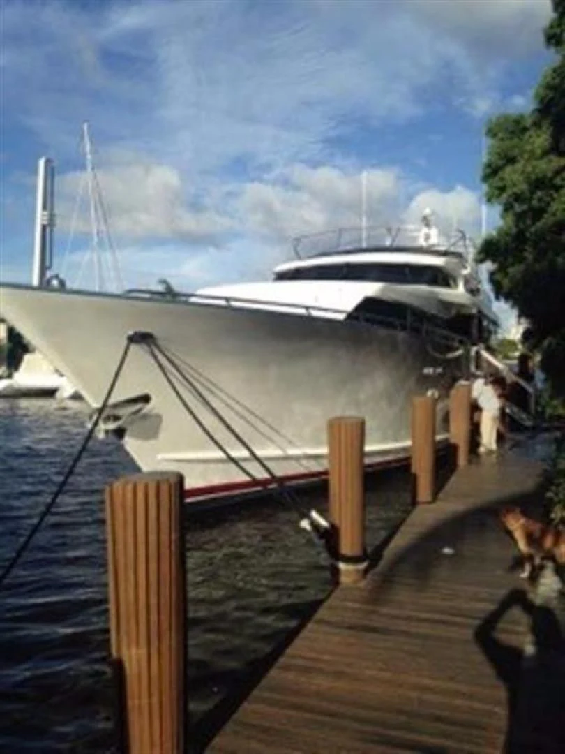 a boat docked at a pier aboard GOLDEN TOUCH Yacht for Sale