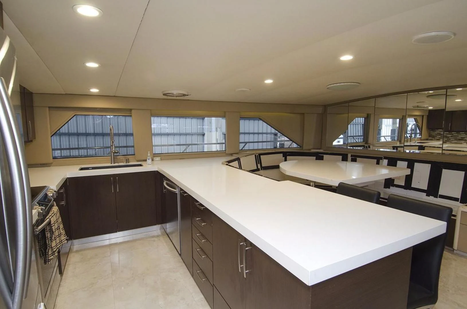 a large kitchen with white counter tops aboard GOLDEN TOUCH Yacht for Sale