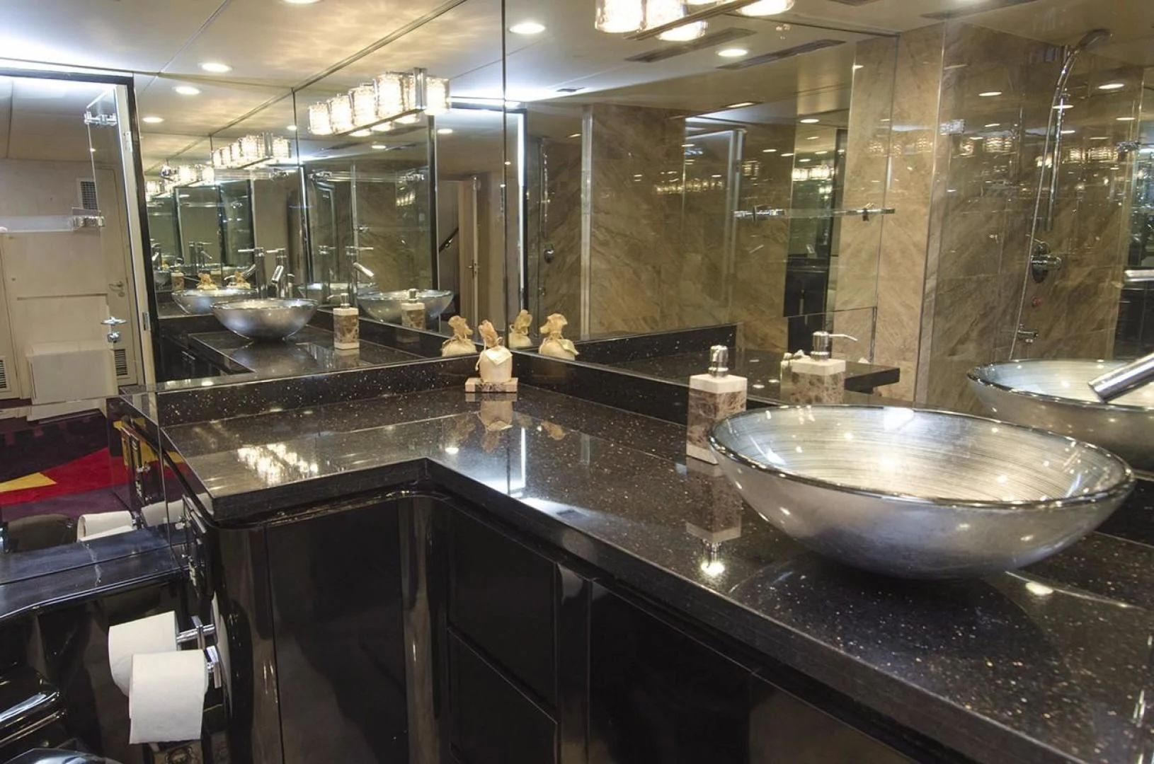 a large bathroom with a large mirror aboard GOLDEN TOUCH Yacht for Sale