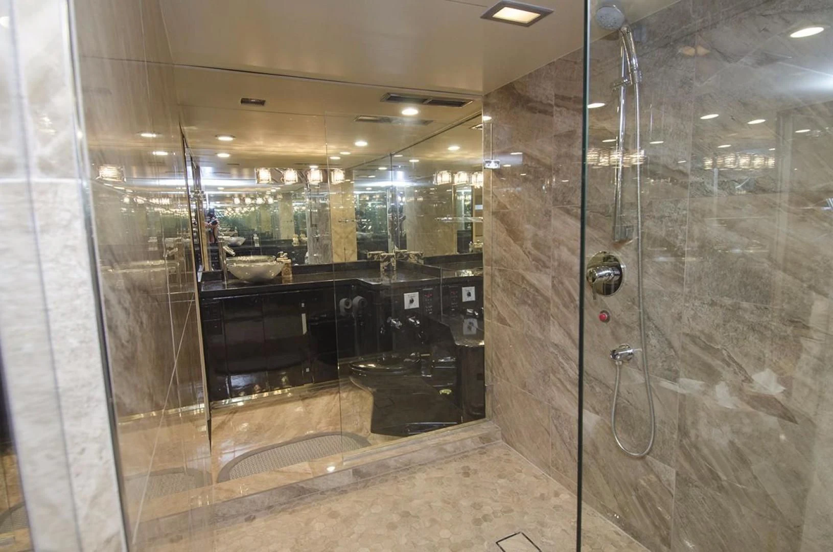 a large bathroom with glass walls aboard GOLDEN TOUCH Yacht for Sale