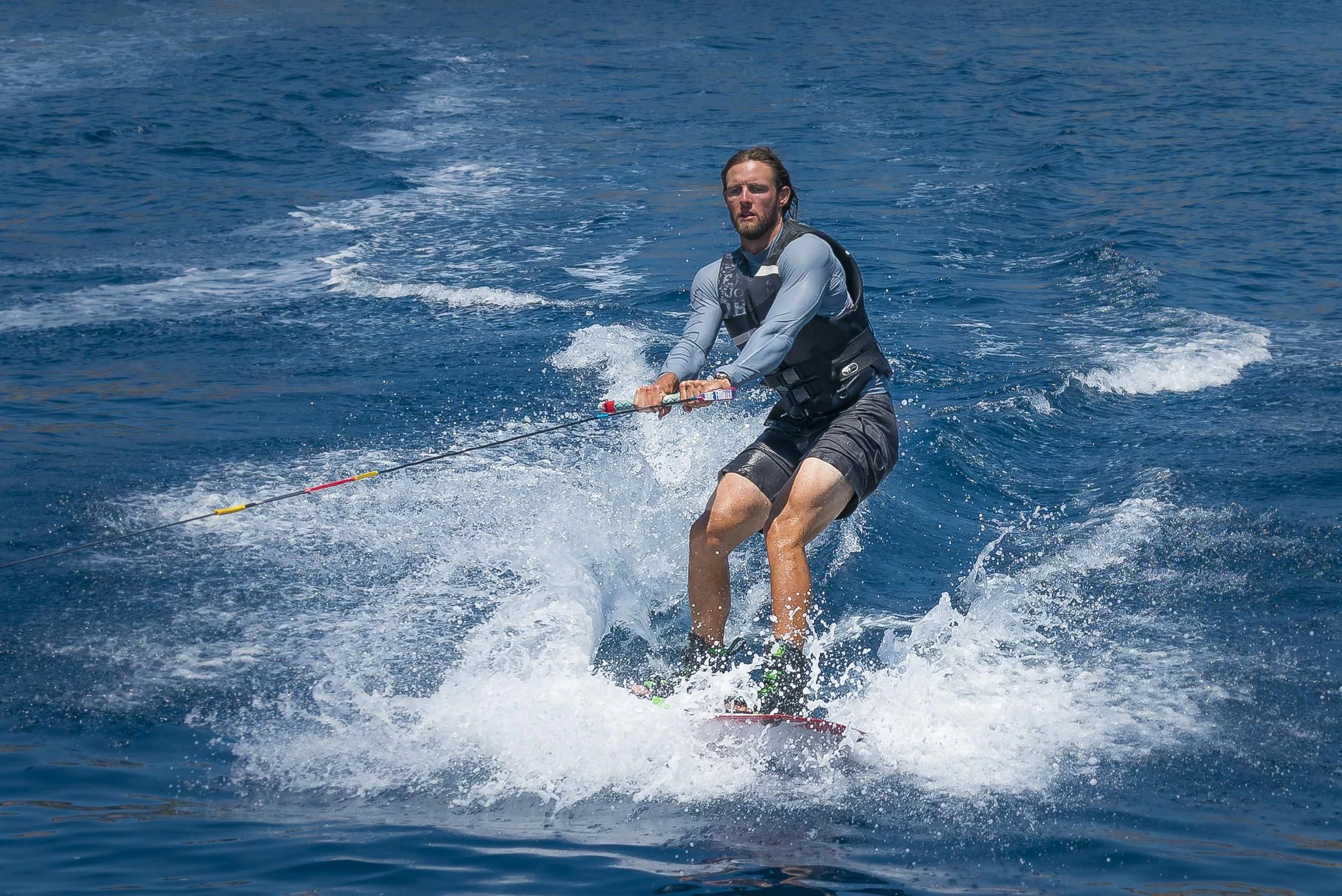 a man is water skiing aboard SHARLOU Yacht for Sale