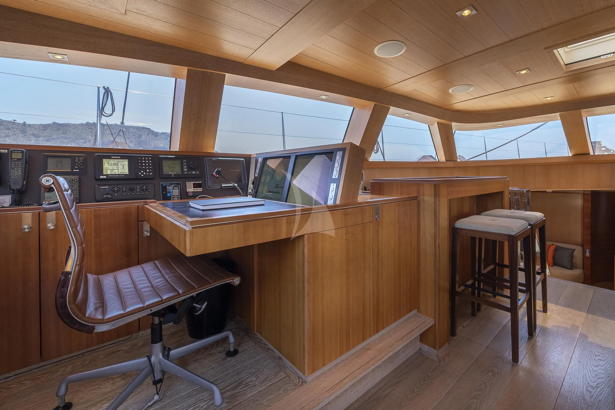 a room with a desk and chairs aboard SHARLOU Yacht for Sale