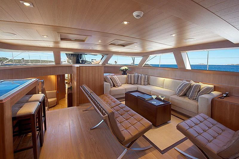 a living room with a couch and a table aboard SHARLOU Yacht for Sale
