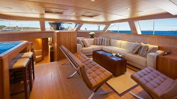a living room with a couch and a table aboard SHARLOU Yacht for Sale