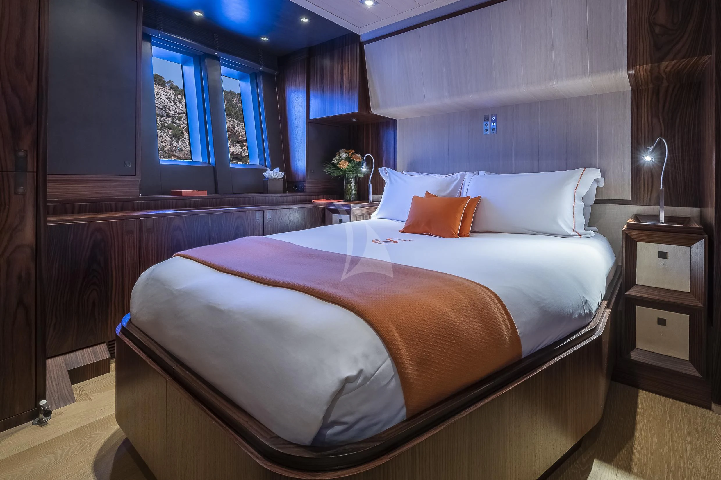 a bed with a white comforter aboard SHARLOU Yacht for Sale