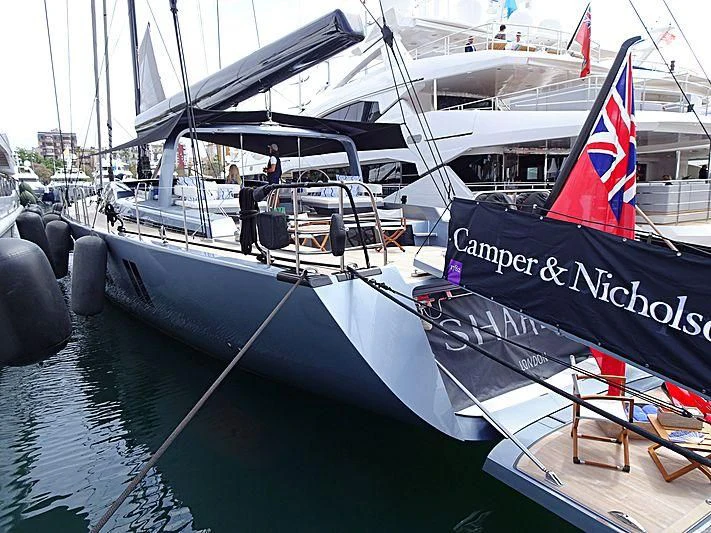 a boat with a flag on the front aboard SHARLOU Yacht for Sale